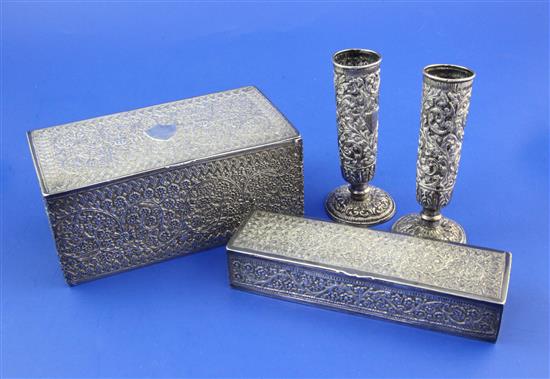 Two Indian silver rectangular boxes and a pair of similar spill vases, largest box 6in.